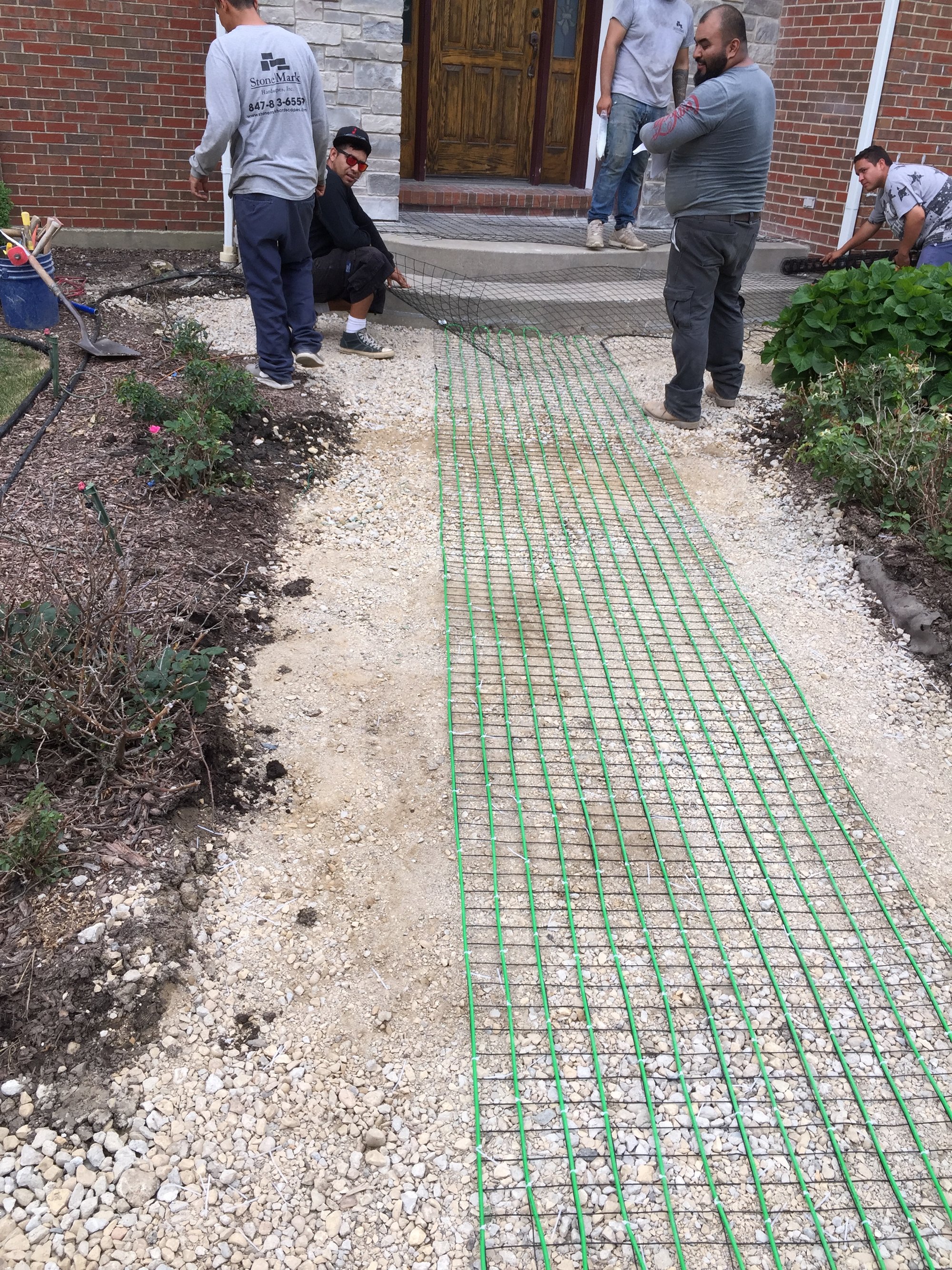 Snow melting cable installed under pavers for a heated walkway