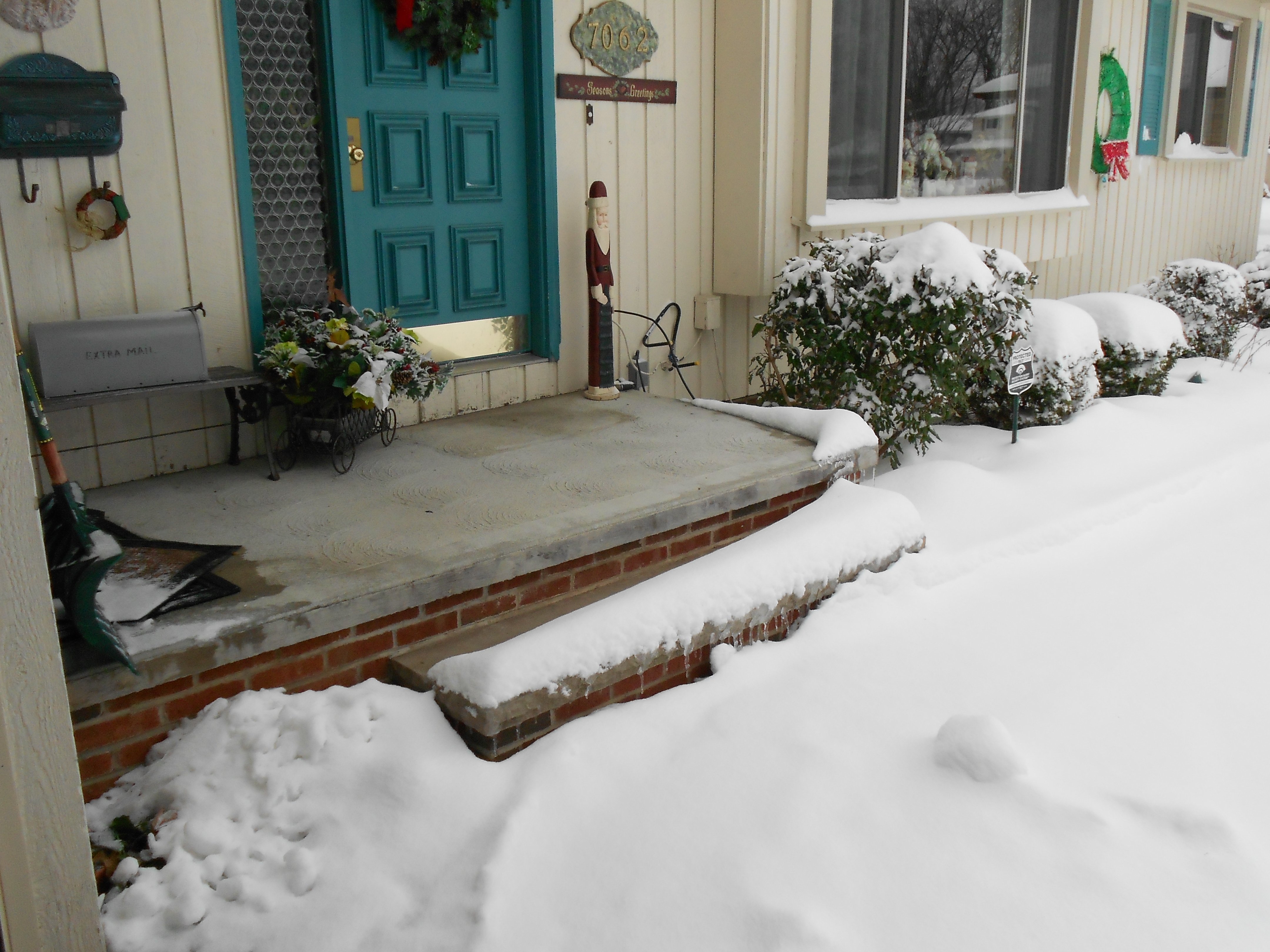 Snow melting system installed on front porch steps in Parma Heights, Ohio, providing safe winter accessibility