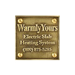 A square WarmlyYours cast brass snow melt plaque with raised lettering for electric slab heating system identification.
