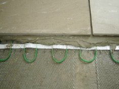 Snow-melting cable can be installed under a ramp for safety.