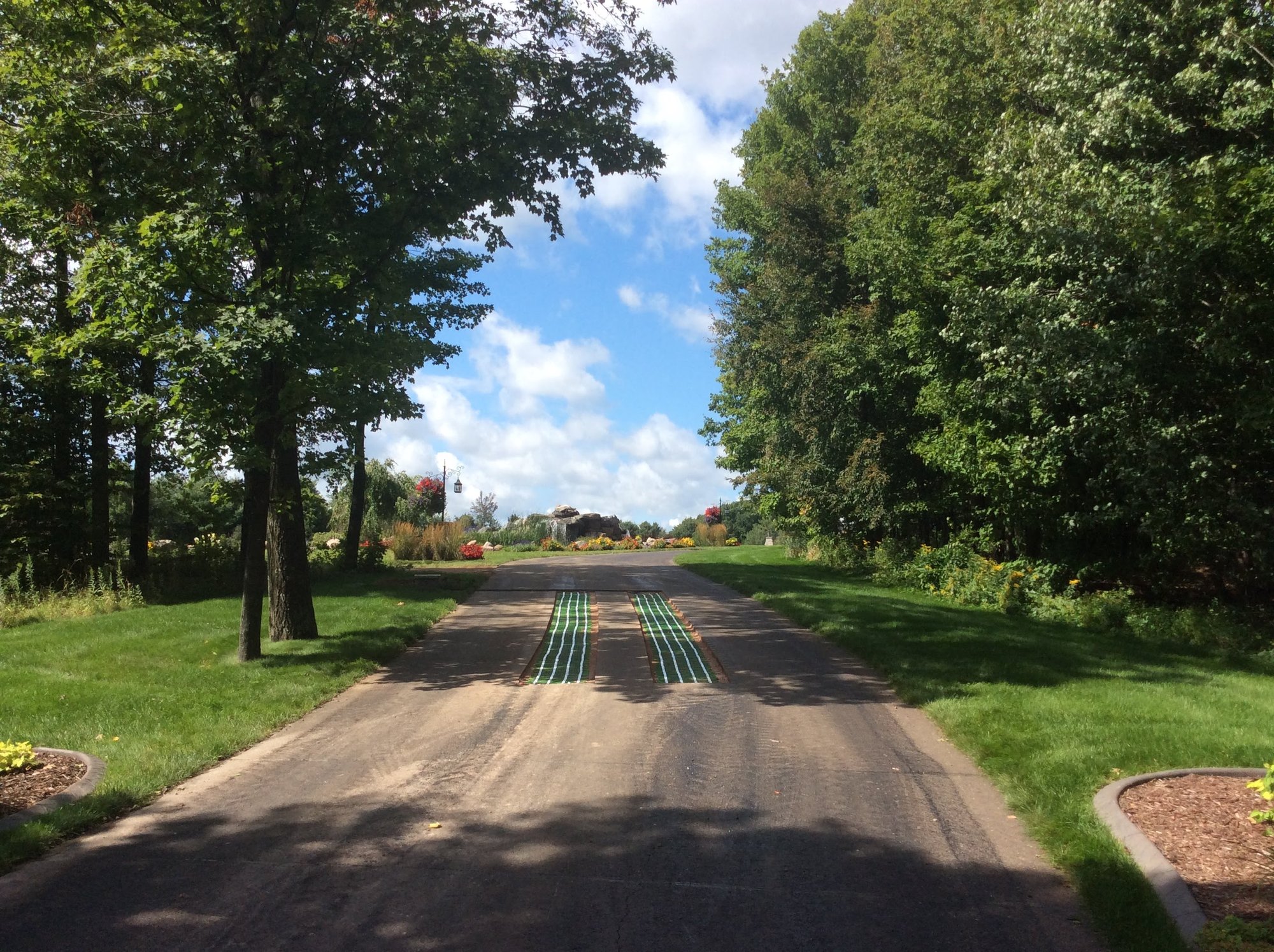 Snow Melt Retrofit for Asphalt Driveway Tire Tracks Wide View