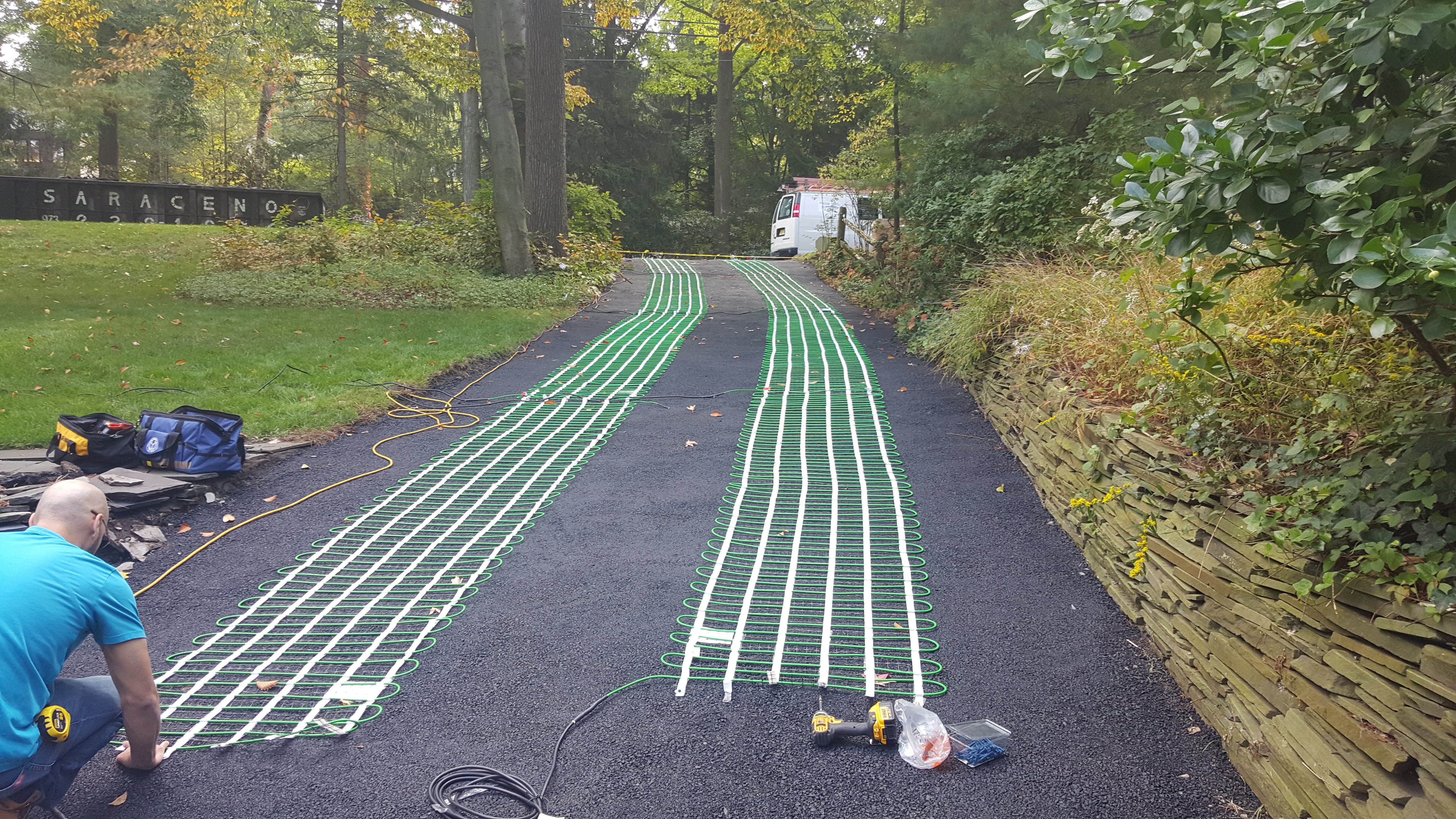 Radiant heat can be installed between layers of asphalt.