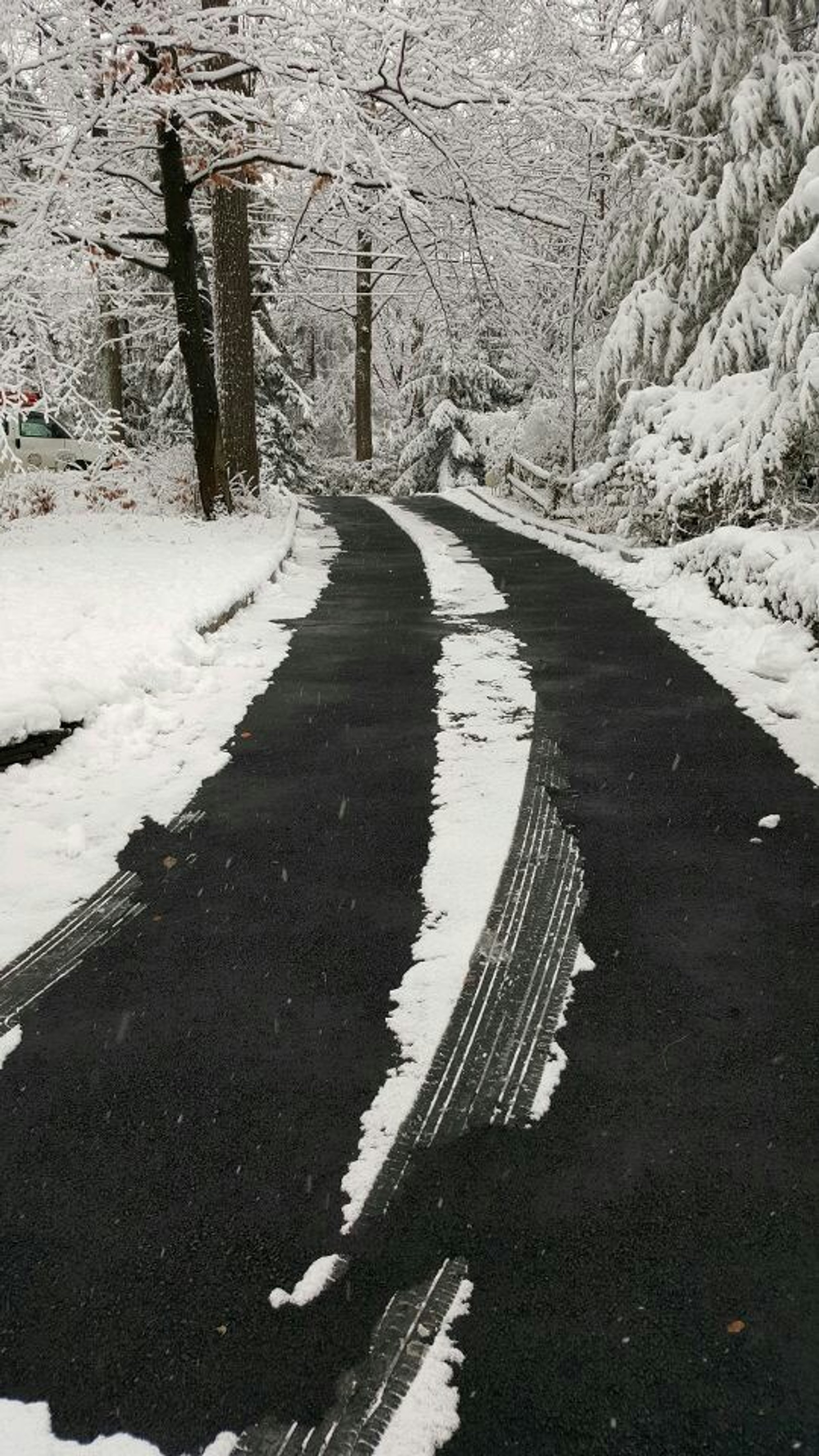 Snow melting system installed in an asphalt driveway with tire tracks by albright electric MAHWAH, NJ