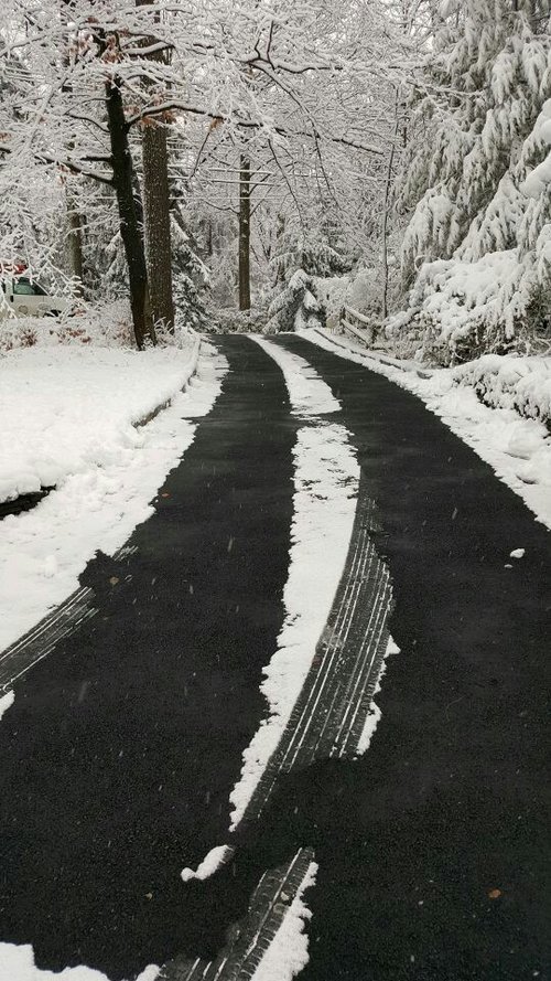 Snow melting system installed in an asphalt driveway with tire tracks by albright electric MAHWAH, NJ