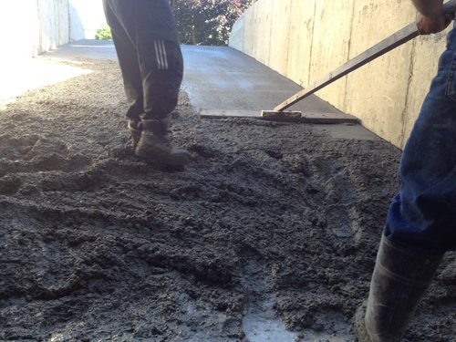 Spreading concrete top layer for Snow Melting Install for Heated Concrete Driveway