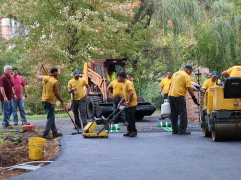 surfacing the asphalt on driveway snow melt project Finished heated asphalt surface