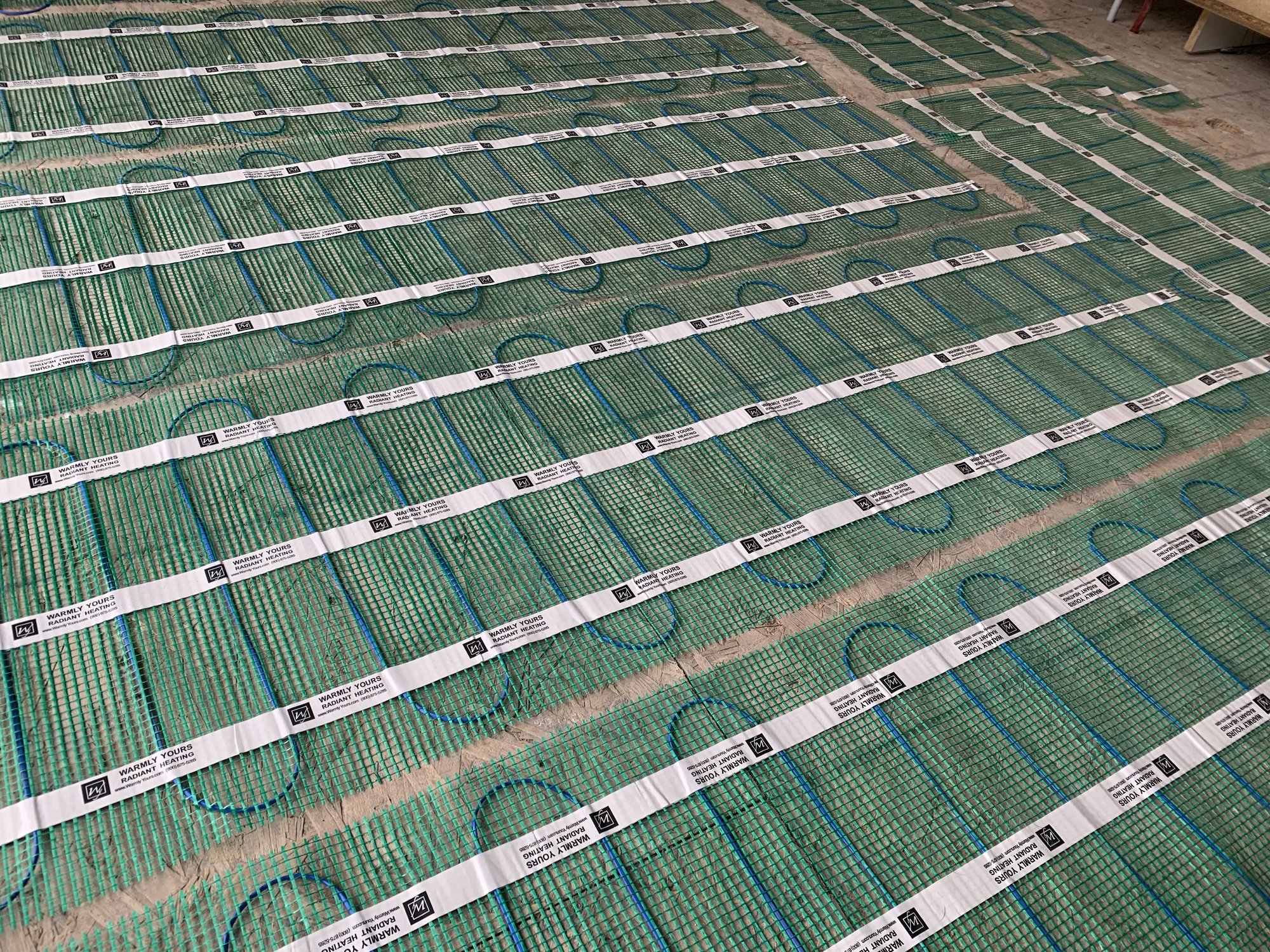 TempZone Flex Roll Installation for Tile Floor in a Kitchen closeup of heating mat