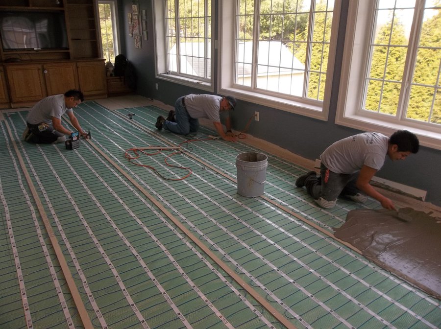 TempZone Flex Rolls being installed under thinset for family room