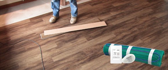 LVT floor being installed over floor heating