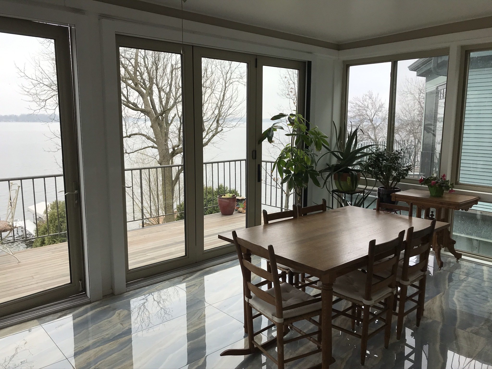 Three season porch sunroom with heated tile floors post installation