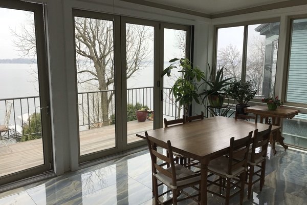 Three season porch sunroom with heated tile floors post installation