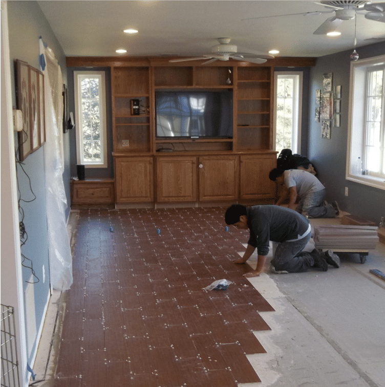 Tile floor with floor sensors being installed over thinset