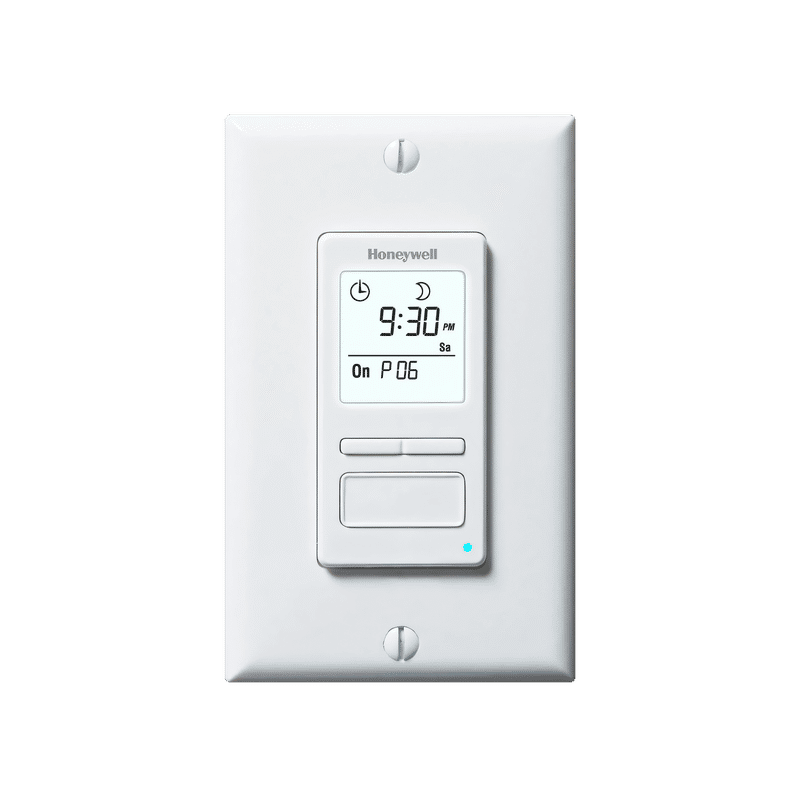 Honeywell programmable timer switch for towel warmers with an LCD display showing time and settings mounted on a white wall plate.