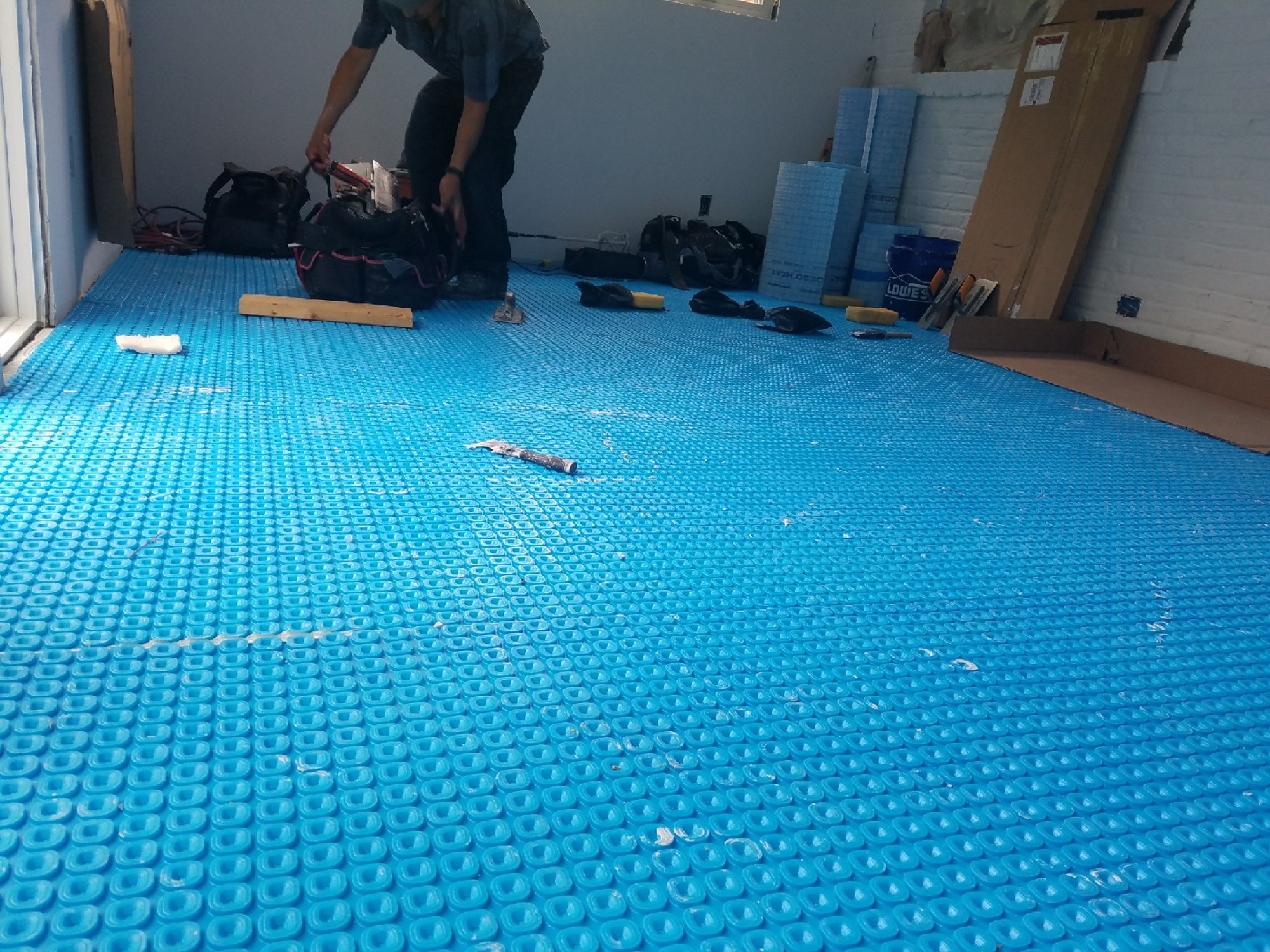 Uncoupling membrane installation for recreation room prodeso layer ALEXANDRIA, VA