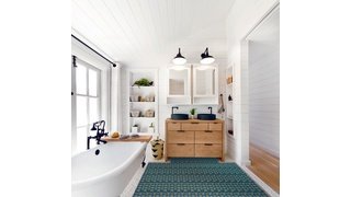 Underfloor heating installed in a tile bathroom with vanity, mirrors and tub.