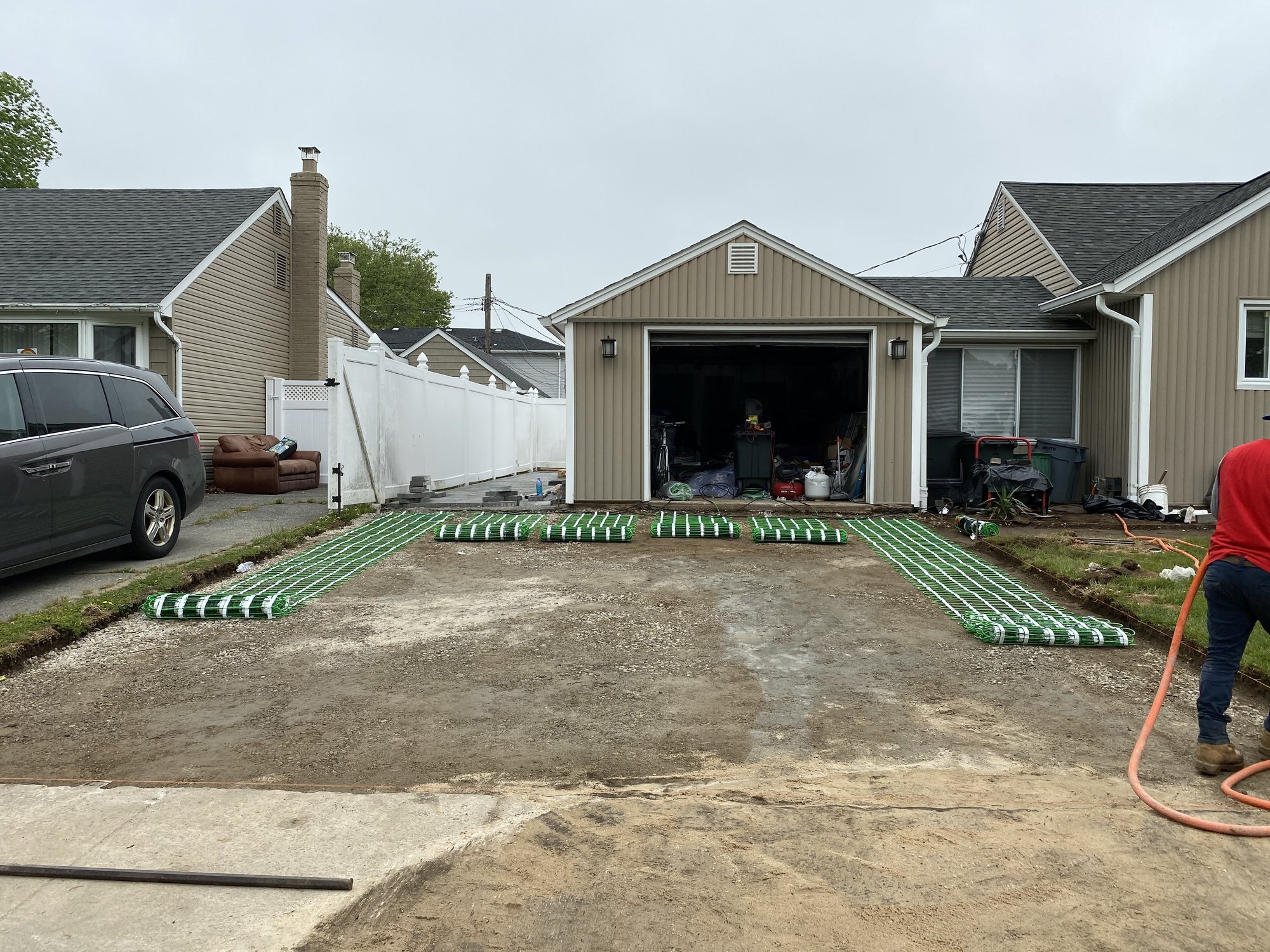 Unrolling snow melting mats for heated driveway EAST MEADOW, NY