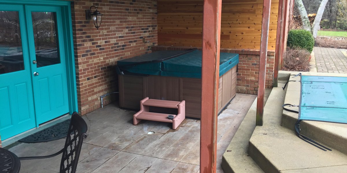 Post installation photos of heated concrete patio at Kildeer house near pool and spa