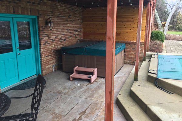 Post installation photos of heated concrete patio at Kildeer house near pool and spa