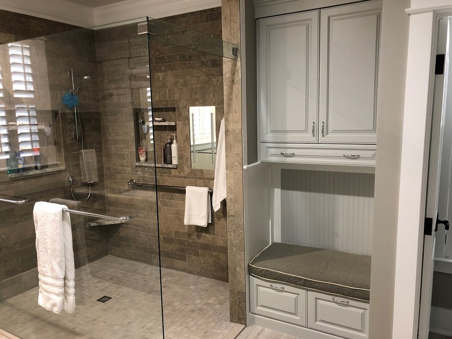 Walk-in curbless shower with heated tile floor by Winslow Design Studio