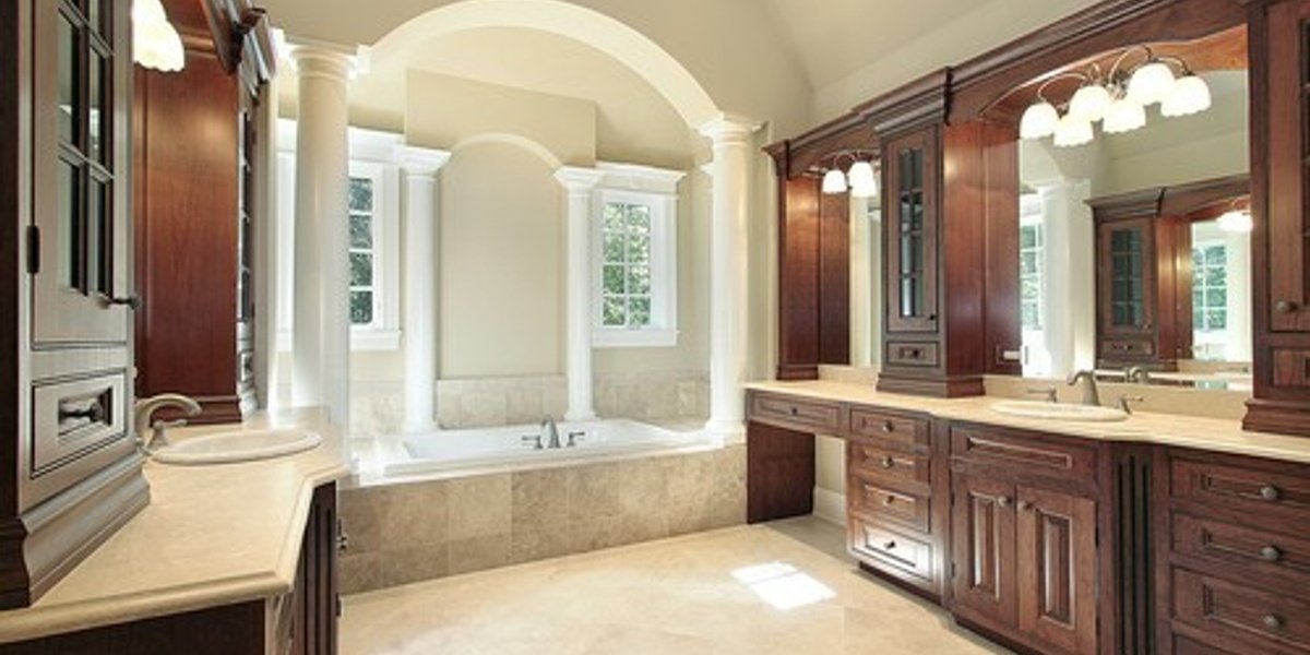 Warm Luxury Master Bathroom with tile floor