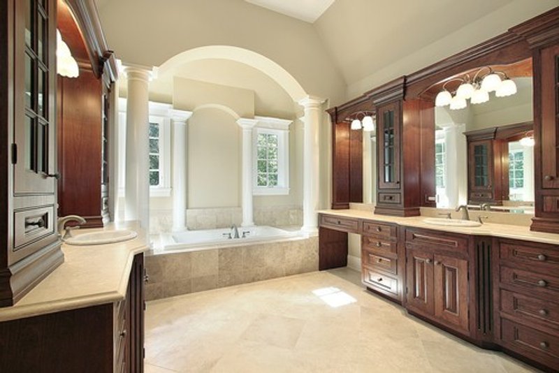 Warm Luxury Master Bathroom with tile floor
