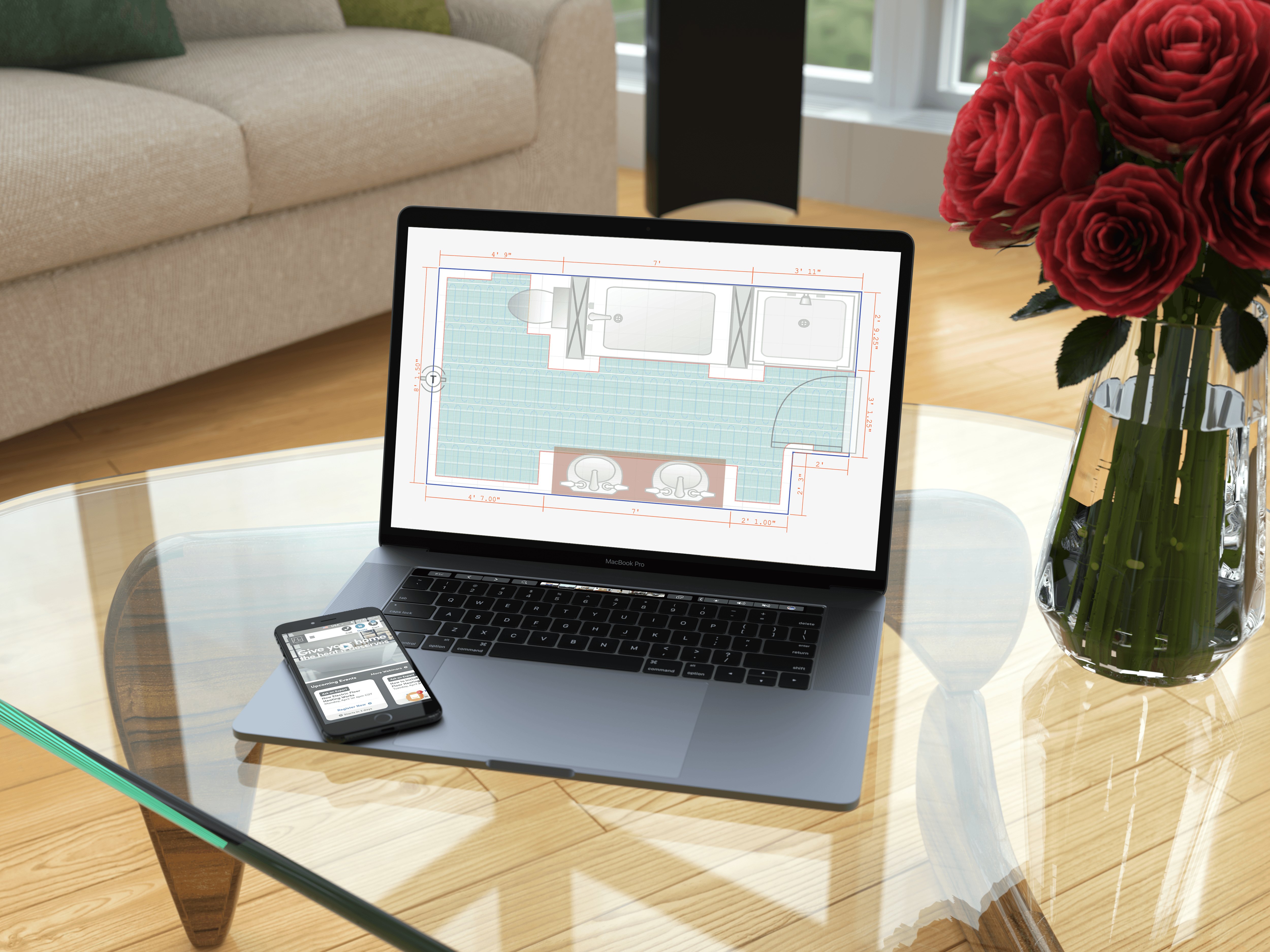 A laptop displaying a WarmlyYours electric radiant floor heating layout and bathroom floor plan on a coffee table.