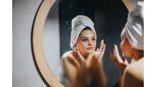 woman with mirror defogger