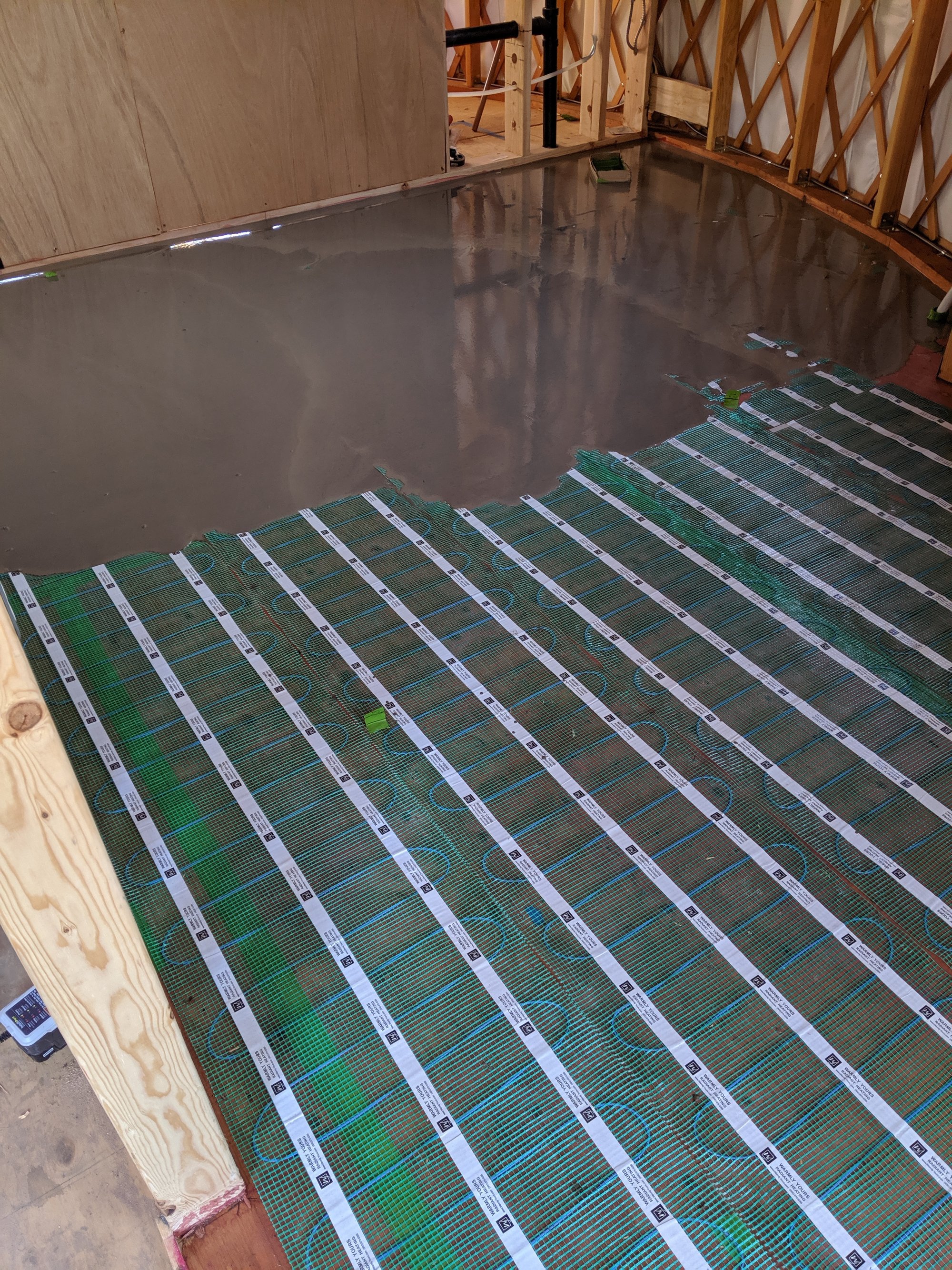 Yurt floor heating project initial step for self leveling cement over floor heating