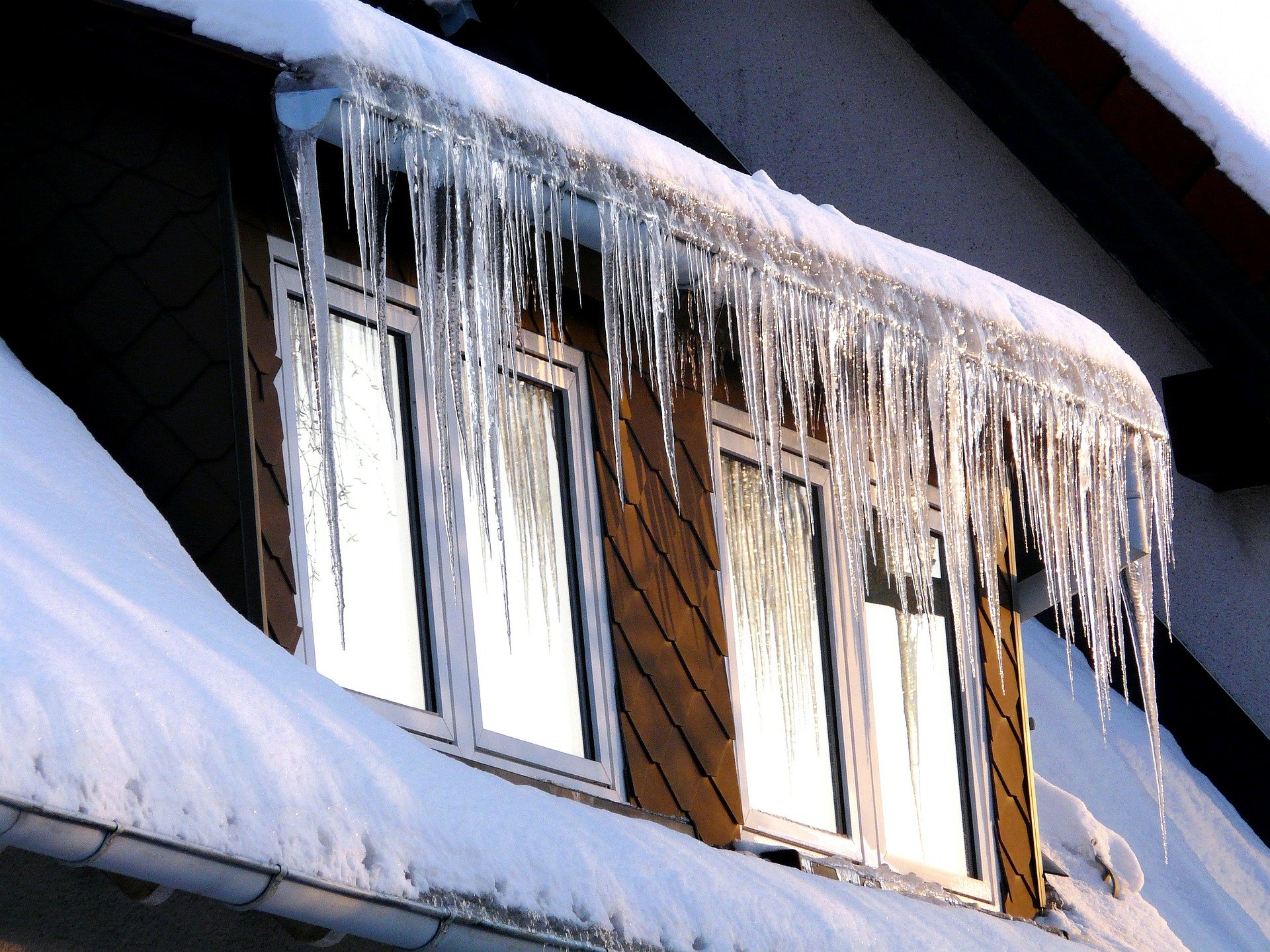 Ice dam on roof during winter