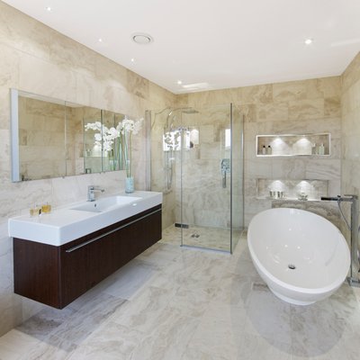 Modern bathroom with floating vanity and freestanding tub