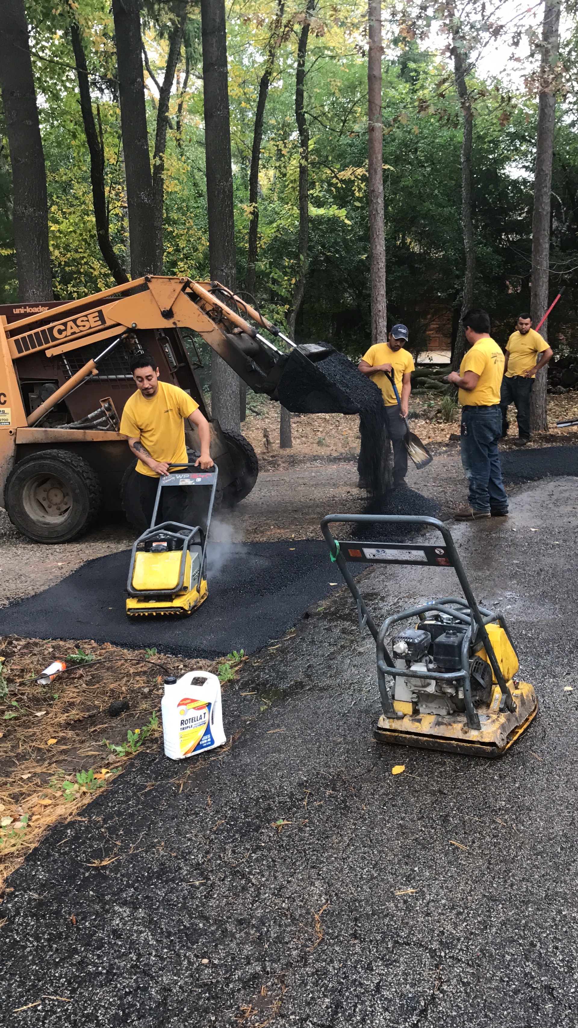 Applying Asphalt Basecoat on Driveway