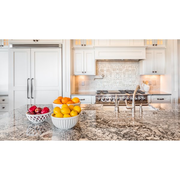 Granite Countertop in a Kitchen with Farm Sink and Fruit Bowls